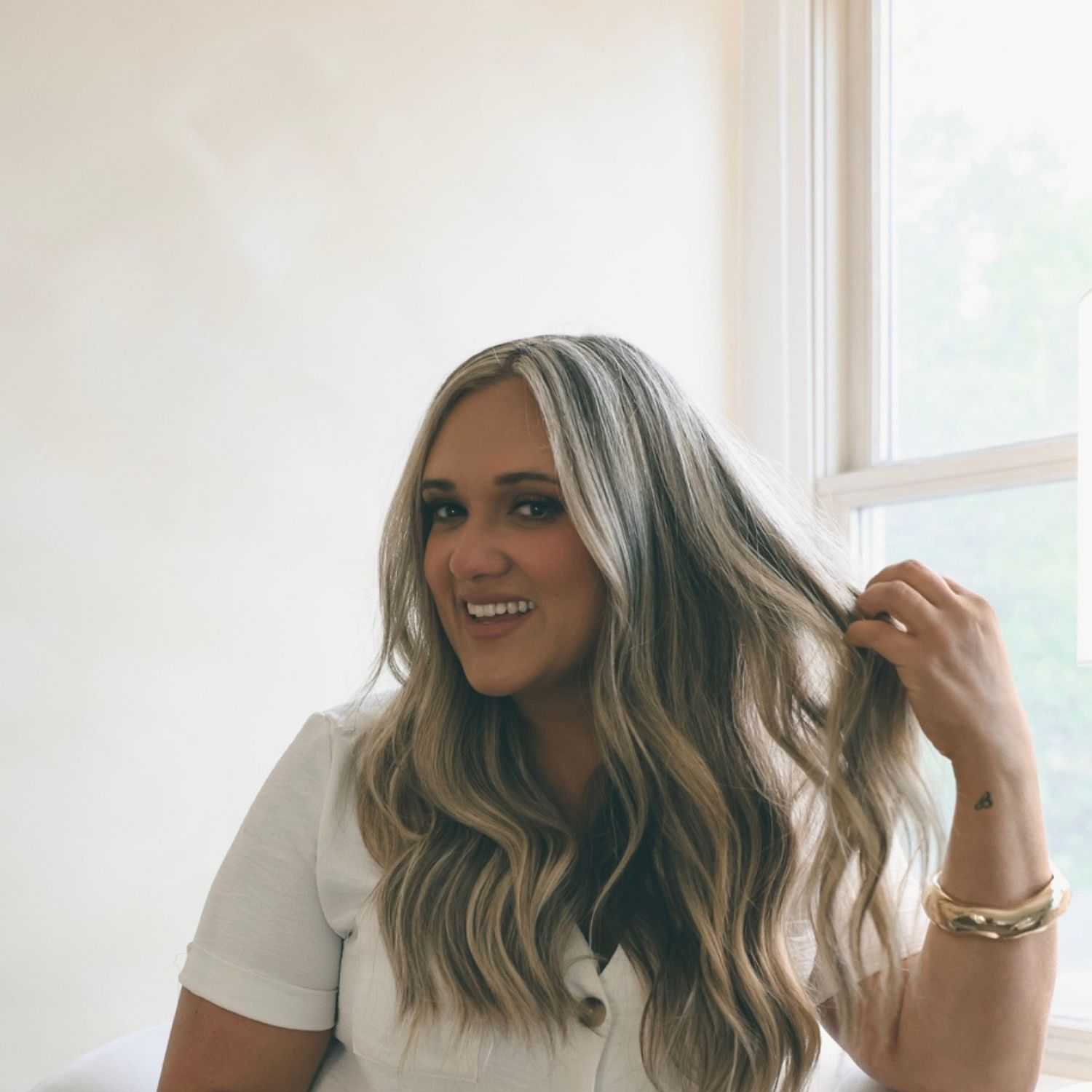 Portrait of Alyse, a professional stylist at Stella Beauty, showcasing their expertise and style.