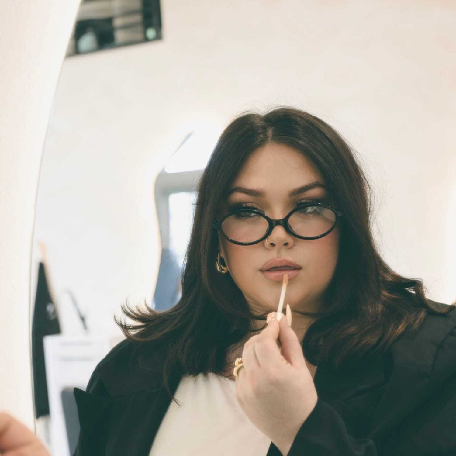 Portrait of Liv, a professional stylist at Stella Beauty, showcasing their expertise and style.