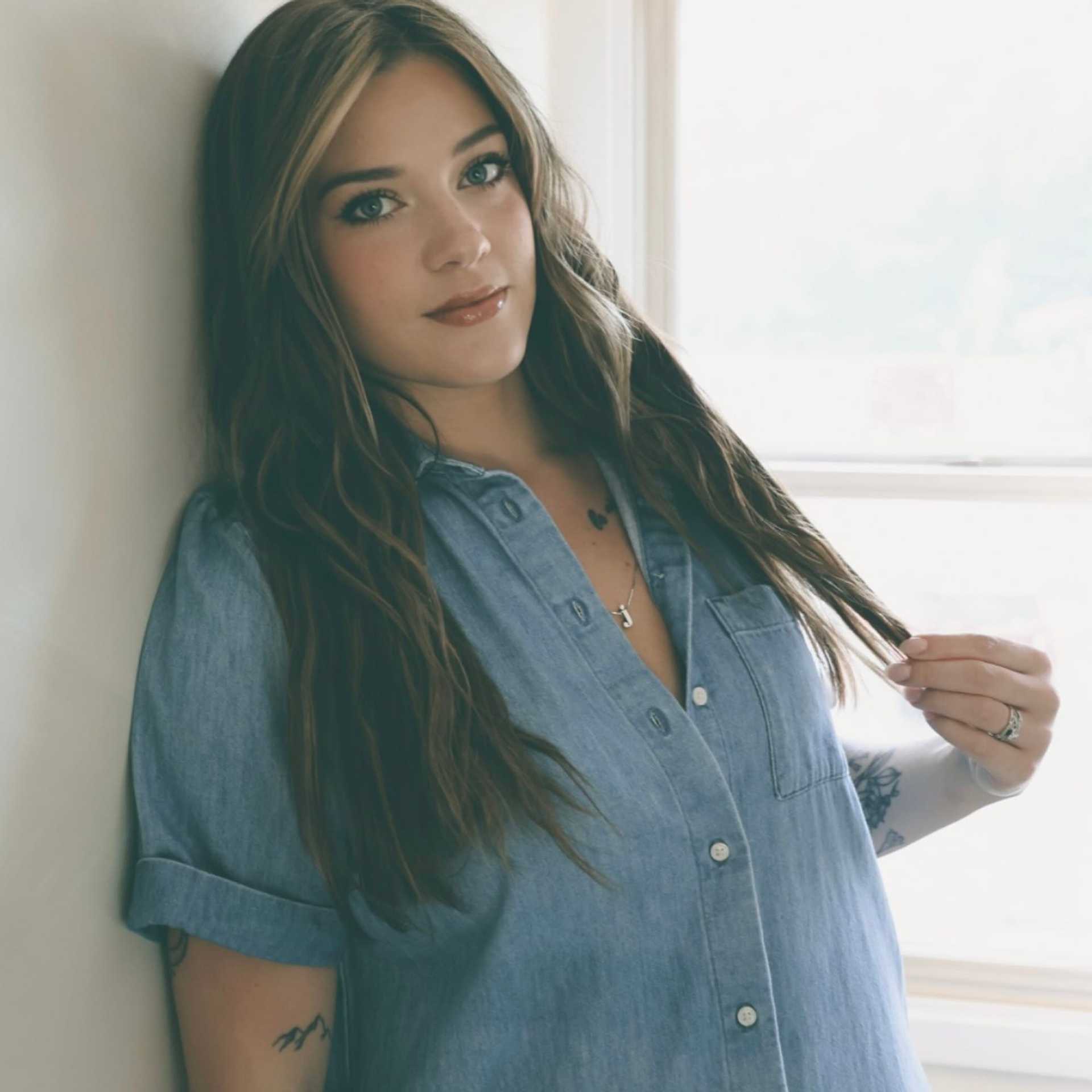 Portrait of Michaela, a professional stylist at Stella Beauty, showcasing their expertise and style.