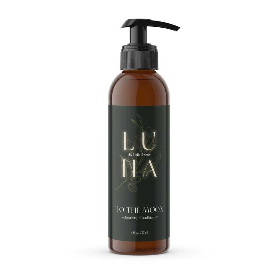 Luna volumizing conditioner bottle with sleek black pump and elegant label design.