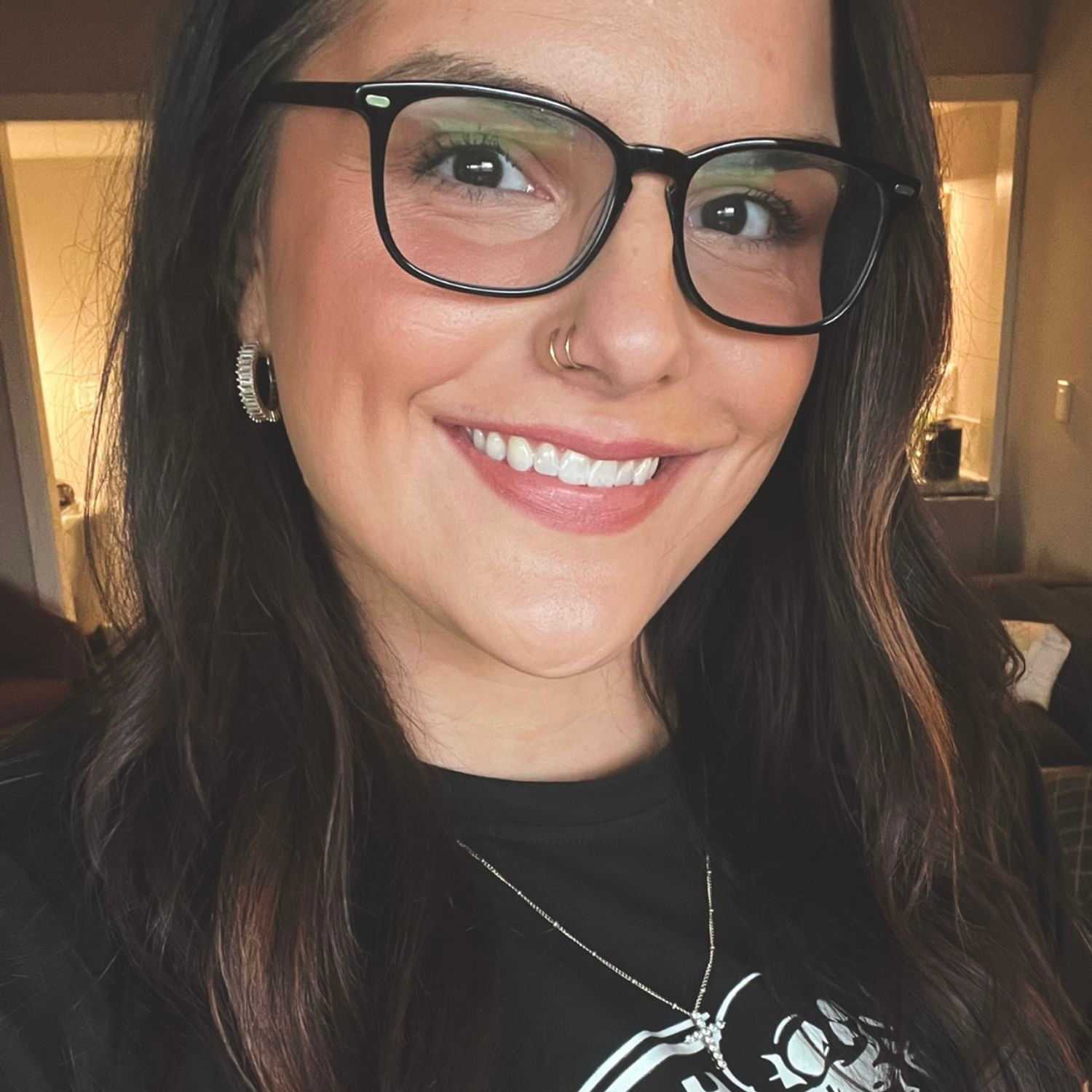 Portrait of Kara, a professional stylist at Stella Beauty, showcasing their expertise and style.